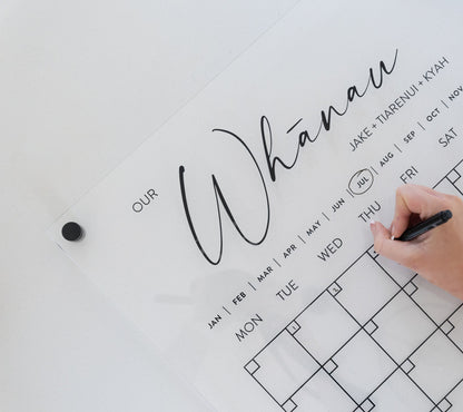 Minimalistic acrylic planner mounted with  black standoff bracket, showcasing elevated modern design.